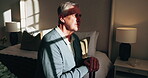 Sad, thinking and old man in retirement home with cane, sunlight and memory loss from Alzheimer disease. Walking stick, unhappy and senior person with disability, dementia and loneliness in bedroom.