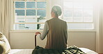 Thinking, back or old woman in home with walking stick, daydream or nostalgia in calm mindset. Reflection, flare and elderly person with disability, flashback or peaceful perspective in retirement.