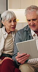 Discussion, tablet or old couple in home, smile or review for booking holiday with online guide. Tech, man and woman talking at house for vacation planning, travel itinerary or happy in retirement