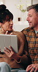 Happy, talking and couple on tablet for planning, online shopping and decision for interior decor. Marriage, home and mature man and woman on tech for research, website and bonding in conversation