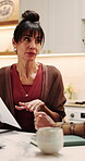 Couple, finance and documents with discussion in kitchen for mortgage payments, bills or investment. Mature man, woman and conversation with paperwork for financial planning or invoices in home