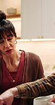 Frustrated, stress and woman with argument in home for spending dispute, financial crisis or upset. Marriage conflict, debt issue and mature people with disagreement for bankruptcy or bills in house