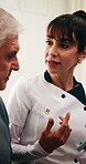 Caregiver, tablet and old man in retirement home with discussion, medical advice or tips for wellness. Senior person and healthcare worker with tech, opinion and recommendation for disease diagnosis.