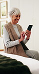 Phone, typing and old woman in retirement home with smile, social media or good news from text message. Happy, senior person and browsing in bedroom with tech, online chat and digital communication.