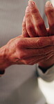 Senior woman, hands and wrist pain with injury in home for arthritis or carpal tunnel syndrome. Closeup, elderly or female person with sore arm for joint inflammation or muscle tension in house