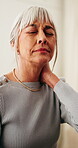 Senior woman, hurt and neck pain in house, discomfort and unhappy with muscle sprain or inflammation. Retirement, reflection and old person with injury, joint tension and arthritis symptoms in home