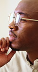 Business, thinking and black man in office with glasses for brainstorming, planning and solution. Professional, happy and person with insight, ideas and reflection for decision, choice and strategy