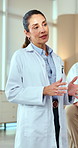 Doctor, woman and speaking in hospital with meeting, instructions and advice for medical service. Mature person, healthcare worker and talk in clinic with insight, planning and tips for patient care.