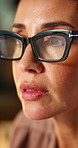 Thinking, online and businesswoman with glasses in office, research and financial update on website. Serious, treasury manager and mature person with eyewear, reflection and risk assessment with info