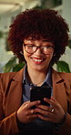 Businesswoman, glasses and laugh with phone in office, chat or search for financial update at night. Wealth manager, texting and happy person with mobile, working late and research with technology