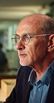 Thinking, glasses and mature man in office for planning, reading and ideas for story headline. Publishing, manager and person with reflection, inspiration and solution for articles at creative agency