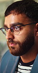 Creative, glasses and business man in office for thinking, reading and ideas for marketing campaign. Night, startup and person with reflection, problem solving and planning for project deadline