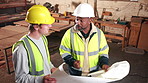 Discussion, men and construction workers on site with blueprint for building, maintenance or repairs. Floor plan, talking and civil engineers in collaboration for renovation or property development.