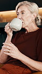 Reflection, drinking coffee and woman relax in home, remember memory and nostalgia on break with peace. Thoughts, morning beverage and mature person at house with vision, introspection or thinking