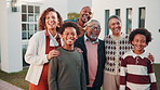 Portrait, happy and big family with hug on property for weekend getaway, bonding or protection. Grandparents, parents and children with smile for reunion, generation gathering or holiday outside home