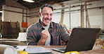 Man, fist pump and woodworker in workshop with laptop for research on furniture manufacturing. Computer, good news and mature carpenter with email for order confirmation with contact in warehouse.