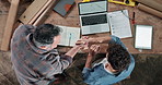 Carpenter, team and blueprint on laptop screen with handshake, project collaboration and help in workshop. Men, tech and shaking hands in factory for design update, woodworking and advice from above