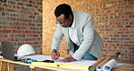 Black man, ruler and drawing on construction site for blueprint, inspection or update planning. Infrastructure, quality control and architect with laptop, report or project management for renovation