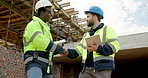 People, tablet and blueprint on construction site with handshake , inspection or remodeling. Low angle, shaking hands and architect team with tech for project management, property or renovation