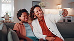 Mother, kid and laugh in home with selfie, funny joke and social media post for childhood memories. Happy, African woman and son in living room with photography, humor and family bonding together.