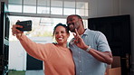 Happy, couple and peace sign in new house with selfie, social media post and property investment. Married, mature African people and moving in dream home with smile, v gesture or picture for memories