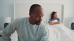 Argument, couple or man in bedroom with tension, fight or frustration in toxic relationship. Conflict, issue or people in house with disagreement, partner disappointment or mistake in marriage crisis