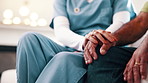Holding hands, empathy and nurse with senior man on sofa in home with checkup for medical diagnosis. Help, volunteer and caregiver with elderly patient for support on healthcare recovery in house.