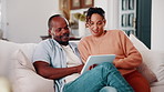 Couple, talking and financial planning with tablet in lounge, online or investment update on website. Interracial, relationship and people with technology for budget review, scroll and chat in house