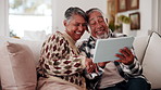Tablet, discussion and old couple in house with laugh, funny online story and joke for bonding together. Happy, married senior people and talk in home with tech, comedy video and retirement wellness.