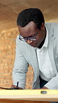 Architect, writing or black man with blueprint for construction planning, design or development. Male person, civil engineer or building designer with floor layout for architecture safety or security