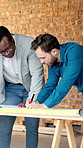 People, engineer and writing at site with document, blueprint and drawing design for construction. Team, reading and discussion with paperwork, sketch building and change floor plan for architecture