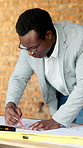 Black man, engineer and measuring at site with document, blueprint and drawing for construction. Male person, writing and ruler with paperwork, sketch building and change floor plan for architecture