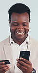 Happy, phone or black man with credit card in studio for online shopping on a white background. Businessman, shopper or smile with smartphone or debit for ecommerce app, transaction or mobile payment