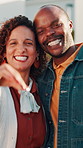 Face, couple and keys outdoor at new house, property purchase and approval for relocation. Portrait, interracial people and happy at front door for moving in, ownership and investment for real estate