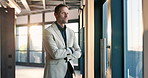 Window, thinking and businessman in office with arms crossed, ambition and planning for realtor. Reflection, space and mature person with investment opportunity, confidence and pride in agency