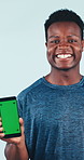 Face, fitness and happy man with phone for green screen in studio, marketing or dance on background. Mobile display, black person or laugh with mockup space, exercise app and gym subscription ad