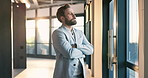 Crossed arms, thinking and businessman in office for ideas, decision or choice on finance career. Confident, serious and financial manager with solution for job opportunity by window in workplace.