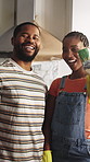 Face, couple and painting at new house with smile, renovation and support for diy project. Portrait, black people and laugh in kitchen with paintbrush, interior design and maintenance for remodeling