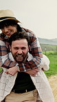 Holiday, face and couple in countryside with piggyback, bonding and fun moment on outdoor trip. Happy, laugh and people on farm with carrying, romantic relationship and playful connection on getaway.
