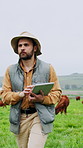Man, walking and tablet on farm with cattle, livestock inspection and research for sustainability. Countryside, farmer and person outdoor with tech for agriculture, animals and supervision of cows.
