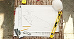 Blueprint, architecture and construction site with floor plan or sketch on table for property design. Creative, engineering drawing and schematic for renovation, remodeling and above for precision