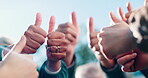 Success, people or hands outdoor with thumbs up, collaboration or approval in positive feedback. Encouragement, flare or team in nature with yes gesture, well done or achievement in group motivation.
