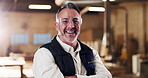Face, man and carpenter in workshop with arms crossed, career pride and about us for manufacturing. Portrait, mature person and goggles in factory with happiness, carpentry and furniture production