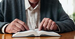 Faith, worship or hands with bible in home for religious study, spiritual growth or word of God. Guidance, person or reading scripture in Holy book for christian wisdom, praise or learning the gospel