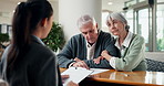 Lawyer, document and old couple in office with consultation, explain last will and testament form. Attorney, paperwork and talk in firm with married senior people, retirement and estate planning.