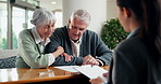 Lawyer, document and old couple in office with meeting, review last will and testament with discussion. Attorney, paperwork and talk in firm with married senior people, retirement or estate planning.