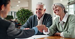 Consultation, handshake and old couple in office with insurance agent, smile and thank you for help. Happy, married senior people and worker shaking hands for policy discussion, agreement and deal.