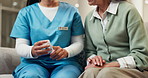 Caregiver, hands and old woman in nursing home with pills, advice and medical discussion for health. Senior person, nurse and talk in retirement center with medicine, prescription and recommendation.
