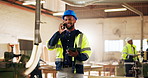 Carpentry, phone call and man in warehouse with tablet, project management or order lumber material. Woodworker, tech and contact in factory for timber supply, schedule update and smile for agreement