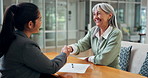 Contract, handshake and old woman in office with insurance agent, sign form and documents with help. Happy, senior person and worker shaking hands with policy agreement, document signature and deal.